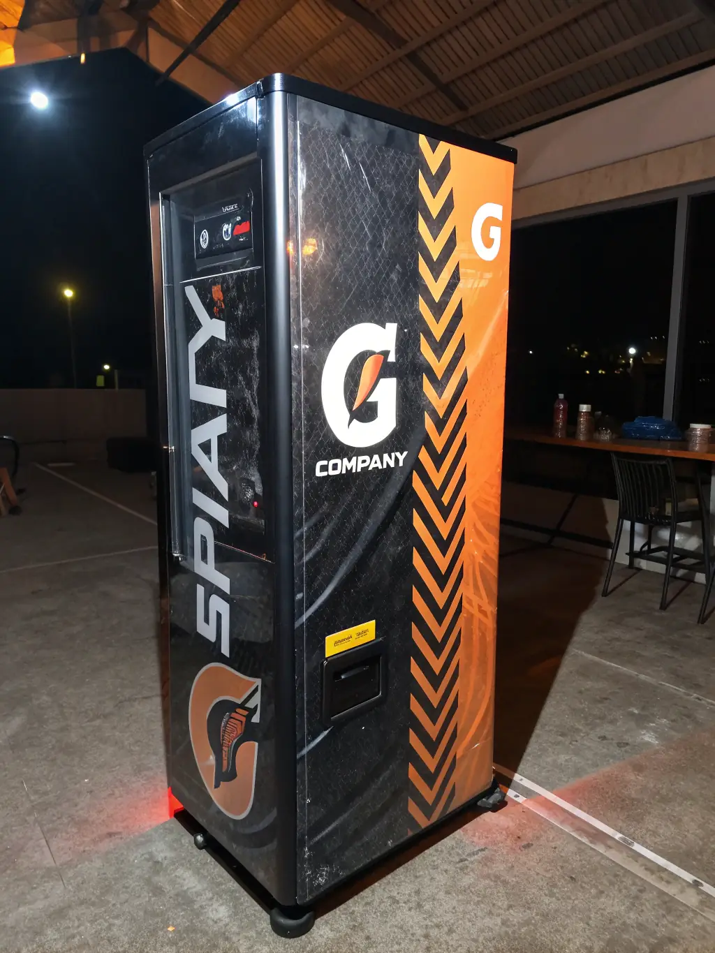 A vending machine being customized with different product options, highlighting the flexibility and adaptability of Rainbow Access's vending solutions to meet specific client needs.